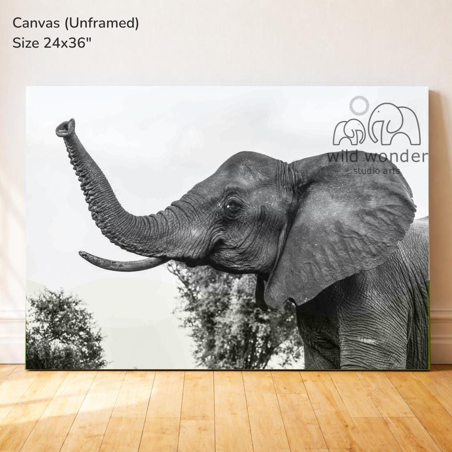 The image is a large canvas print featuring a close-up of an elephant's trunk and head, with trees in the background.