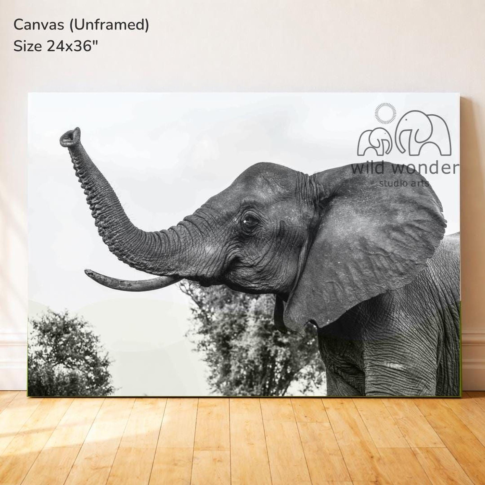 The image is a large canvas print featuring a close-up of an elephant's trunk and head, with trees in the background.