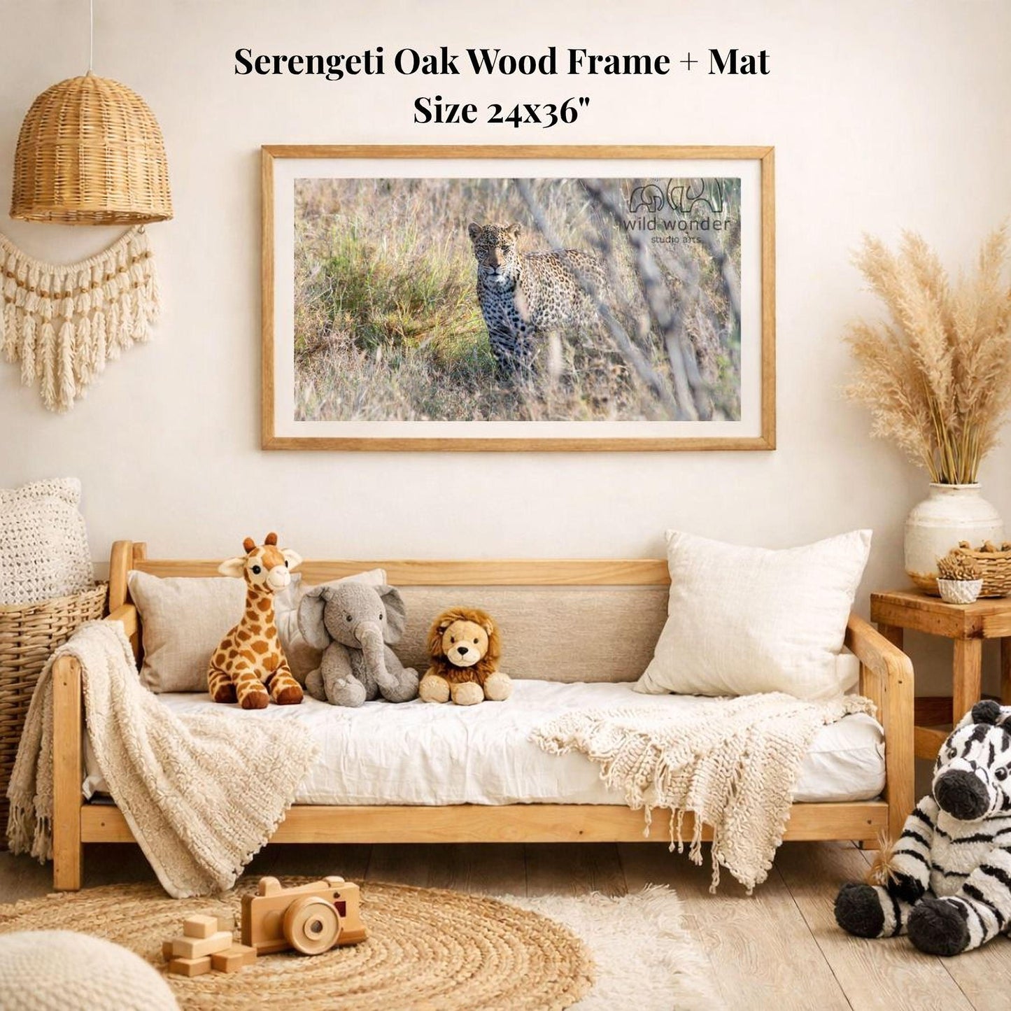 a serene indoor setting with a wooden frame and mat hanging on the wall, displaying a photograph of a leopard in the wild. The frame is surrounded by various stuffed animals, including a giraffe, elephant, lion, and zebra, creating a cozy and playful atmosphere.