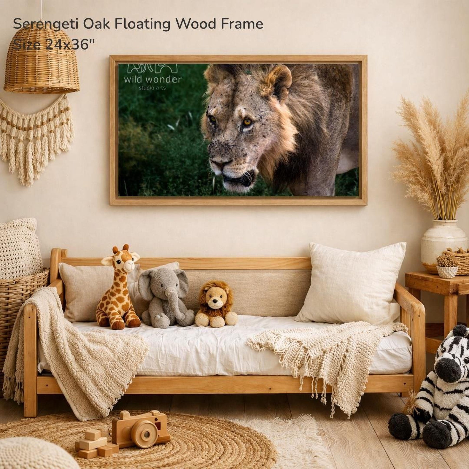 a serene indoor setting with a wooden frame hanging on a wall, displaying a photograph of a lion. The frame is surrounded by various stuffed animals, including a giraffe, an elephant, and a lion, creating a cozy and playful atmosphere.