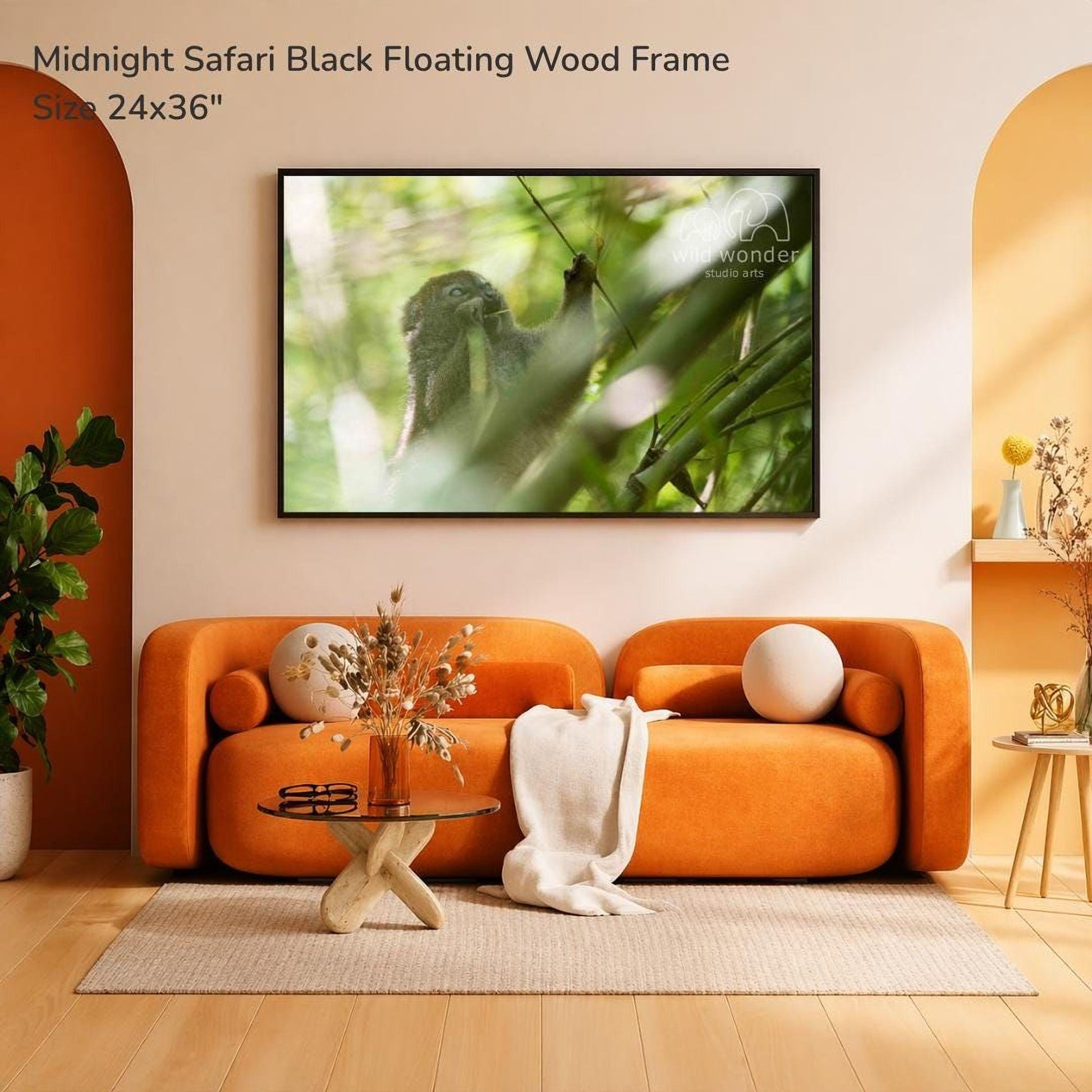a modern living room with an orange sofa, a glass coffee table, and a framed photograph of a black safari animal hanging on the wall.