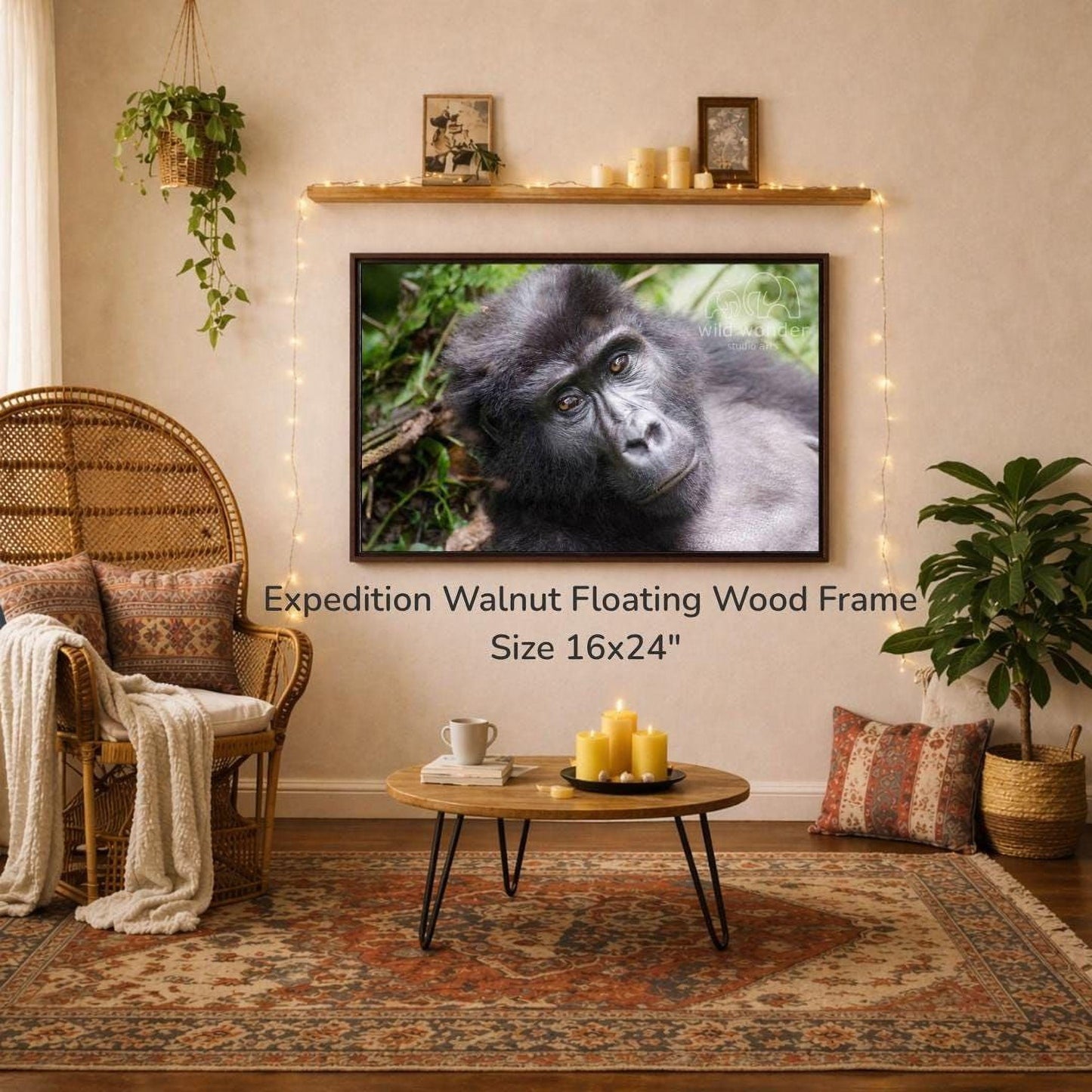 a large, 16x24" walnut floating wood frame hanging on a wall, with a framed photograph of a gorilla in the background. The room has a cozy, rustic atmosphere with a wicker chair, a coffee table, and various decorative elements such as plants and candles.