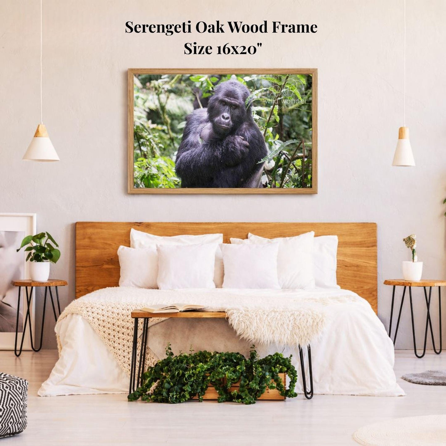 a serene bedroom setting with a large framed picture of a gorilla hanging on the wall above a bed with white bedding.