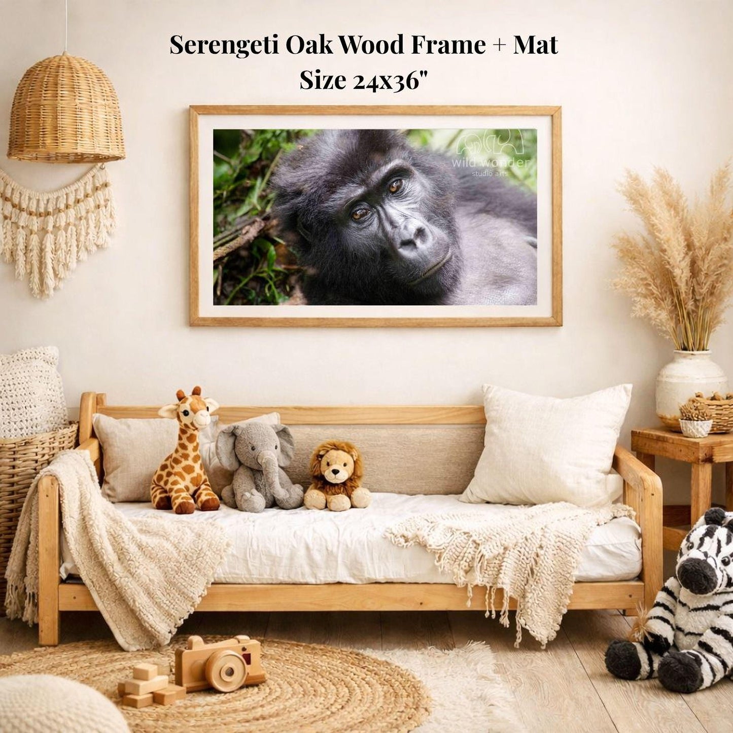 a serene indoor setting with a wooden frame and mat hanging on the wall, displaying a close-up of a gorilla. The room is decorated with various stuffed animals, including a giraffe, elephant, lion, and zebra, arranged on a couch and a rug.